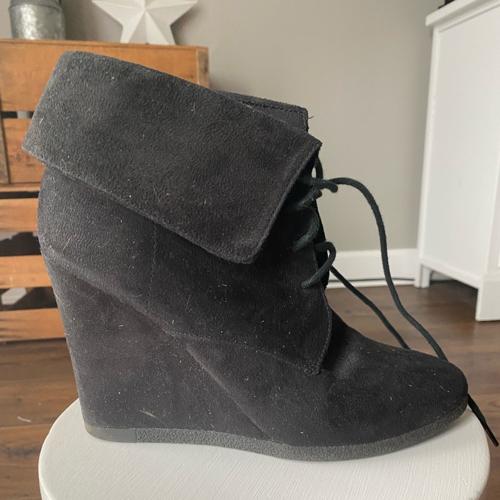 Black suede lace up wedge bootie.